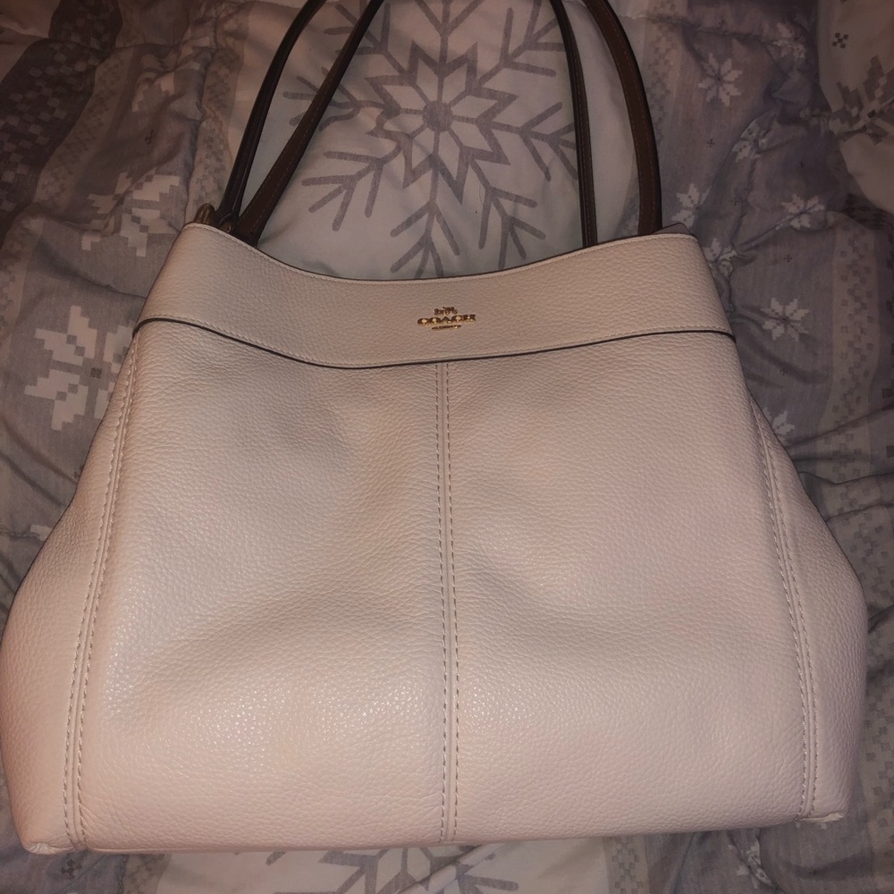 White coach bag w/ brown handles and gold Accents